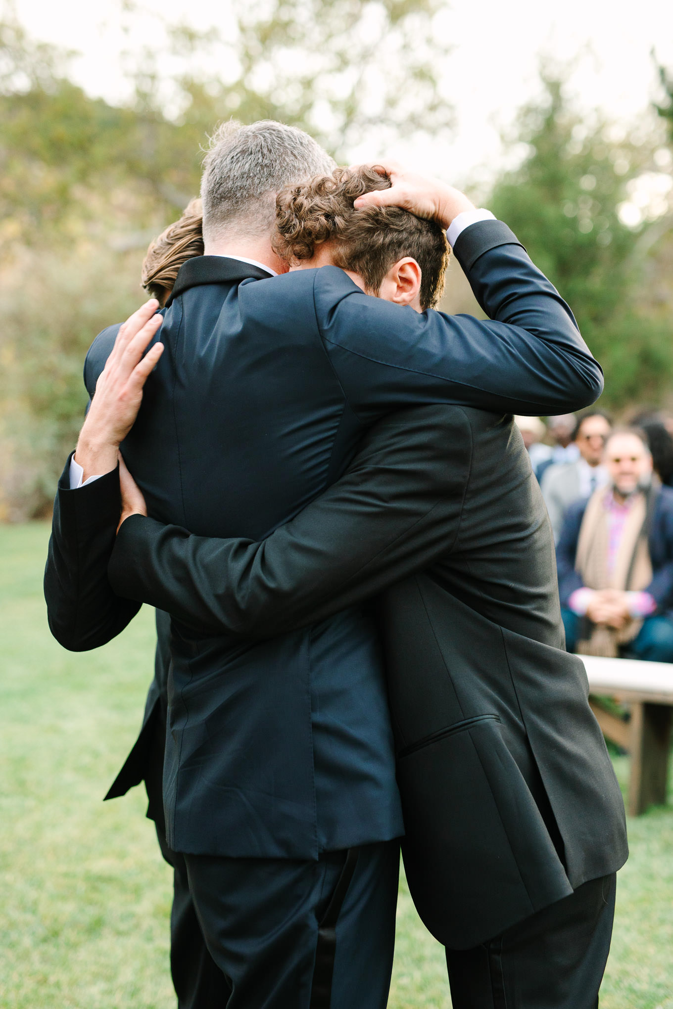 Heartfelt hug between groom and brothers at wedding ceremony | Colorful and quirky wedding at Higuera Ranch in San Luis Obispo | #sanluisobispowedding #californiawedding #higueraranch #madonnainn   
Source: Mary Costa Photography | Los Angeles