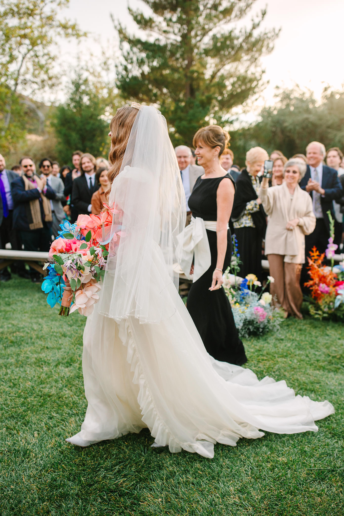 Bride walking down the aisle at wedding ceremony | Colorful and quirky wedding at Higuera Ranch in San Luis Obispo | #sanluisobispowedding #californiawedding #higueraranch #madonnainn   
Source: Mary Costa Photography | Los Angeles