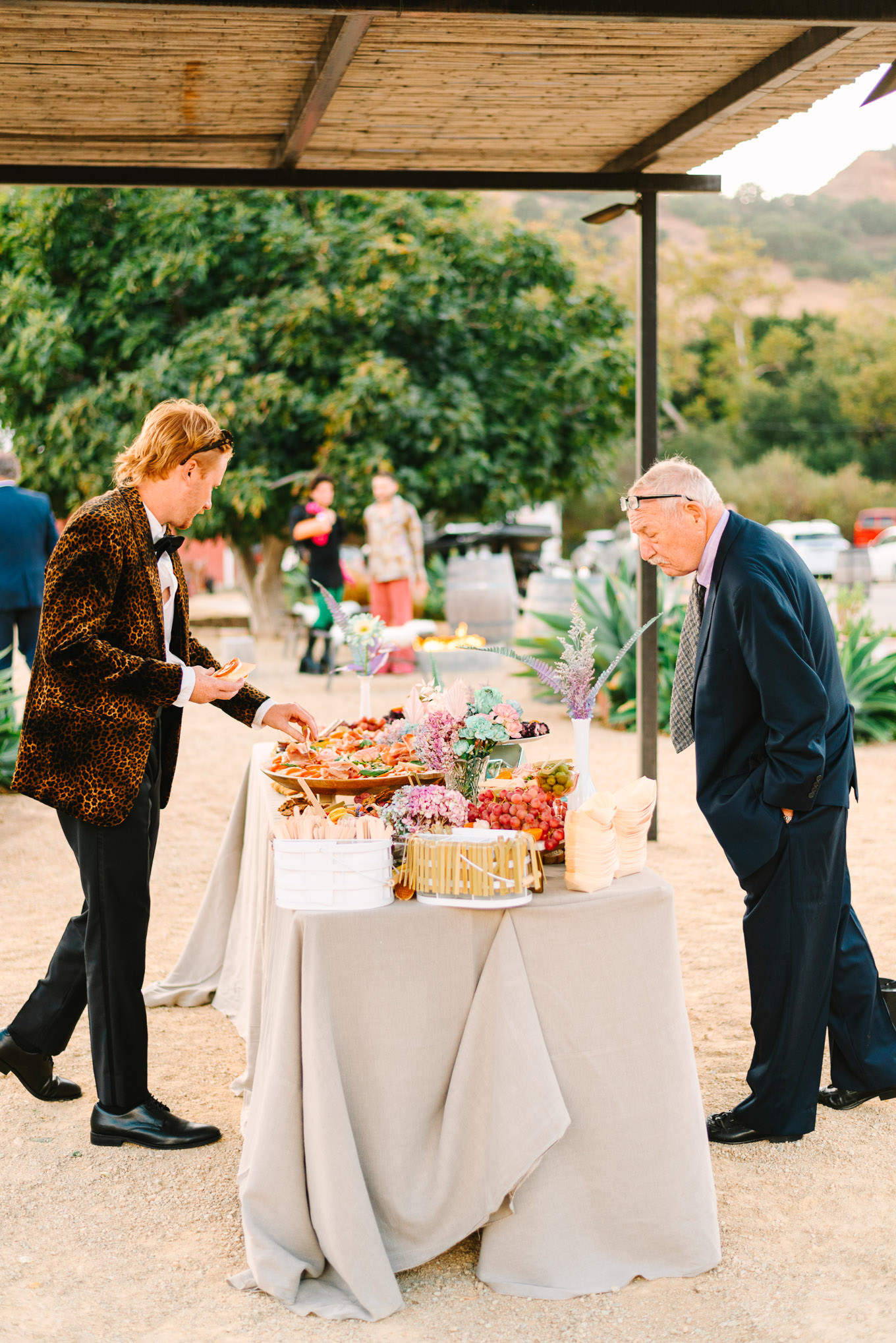Colorful wedding guests enjoying cocktail hour | Colorful and quirky wedding at Higuera Ranch in San Luis Obispo | #sanluisobispowedding #californiawedding #higueraranch #madonnainn   
Source: Mary Costa Photography | Los Angeles