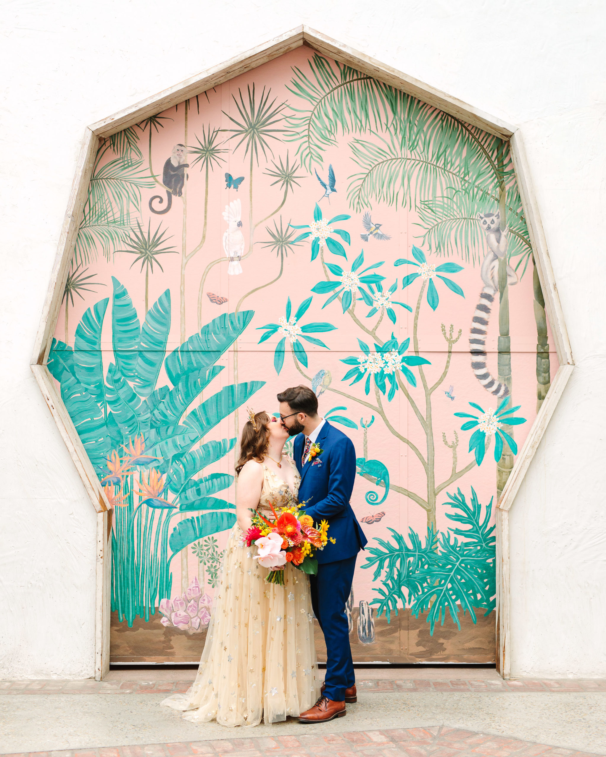 Bride and groom kissing at mural | Colorful Downtown Los Angeles Valentine Wedding | Los Angeles wedding photographer | #losangeleswedding #colorfulwedding #DTLA #valentinedtla   Source: Mary Costa Photography | Los Angeles