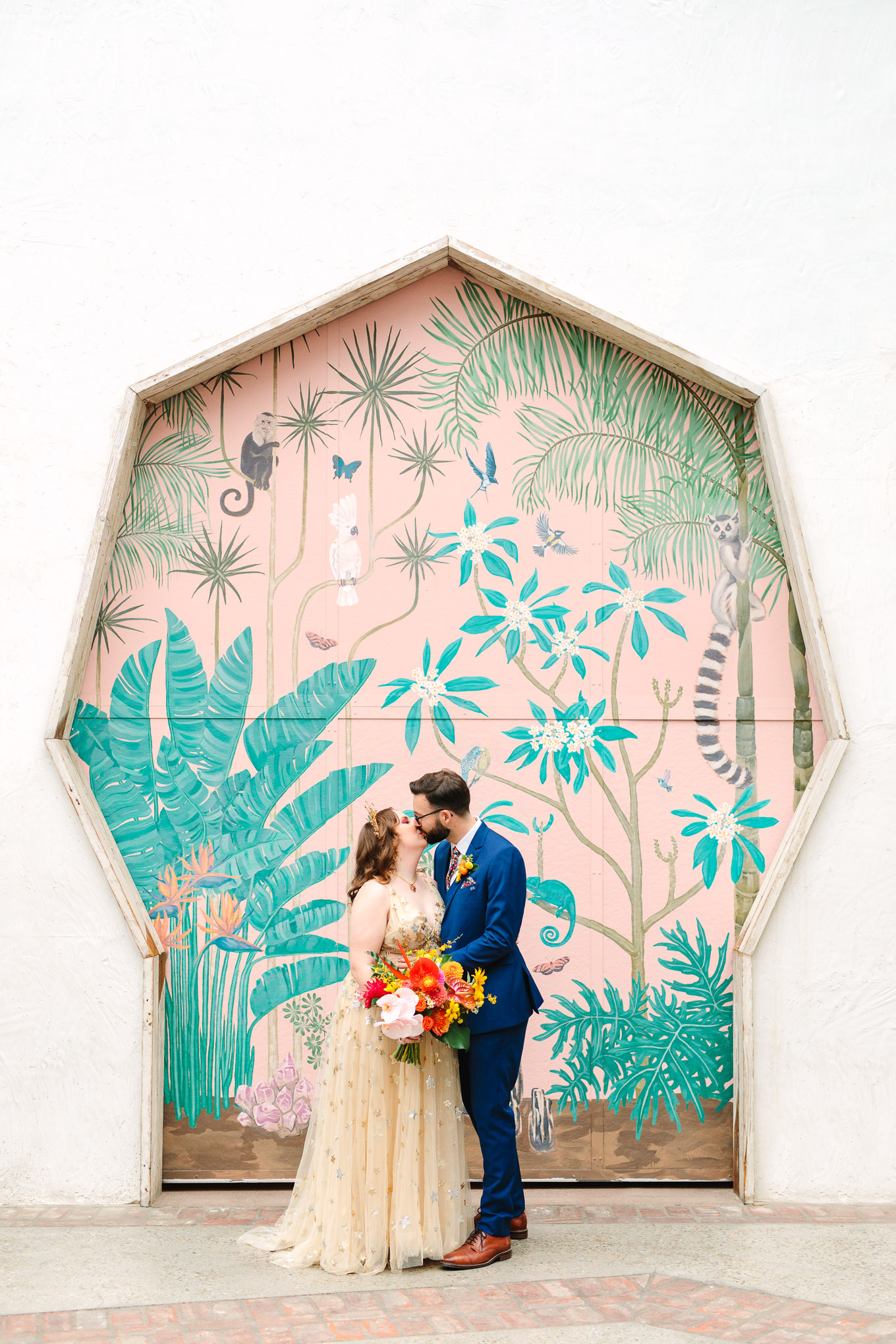 Bride and groom kissing at mural | Colorful Downtown Los Angeles Valentine Wedding | Los Angeles wedding photographer | #losangeleswedding #colorfulwedding #DTLA #valentinedtla   Source: Mary Costa Photography | Los Angeles