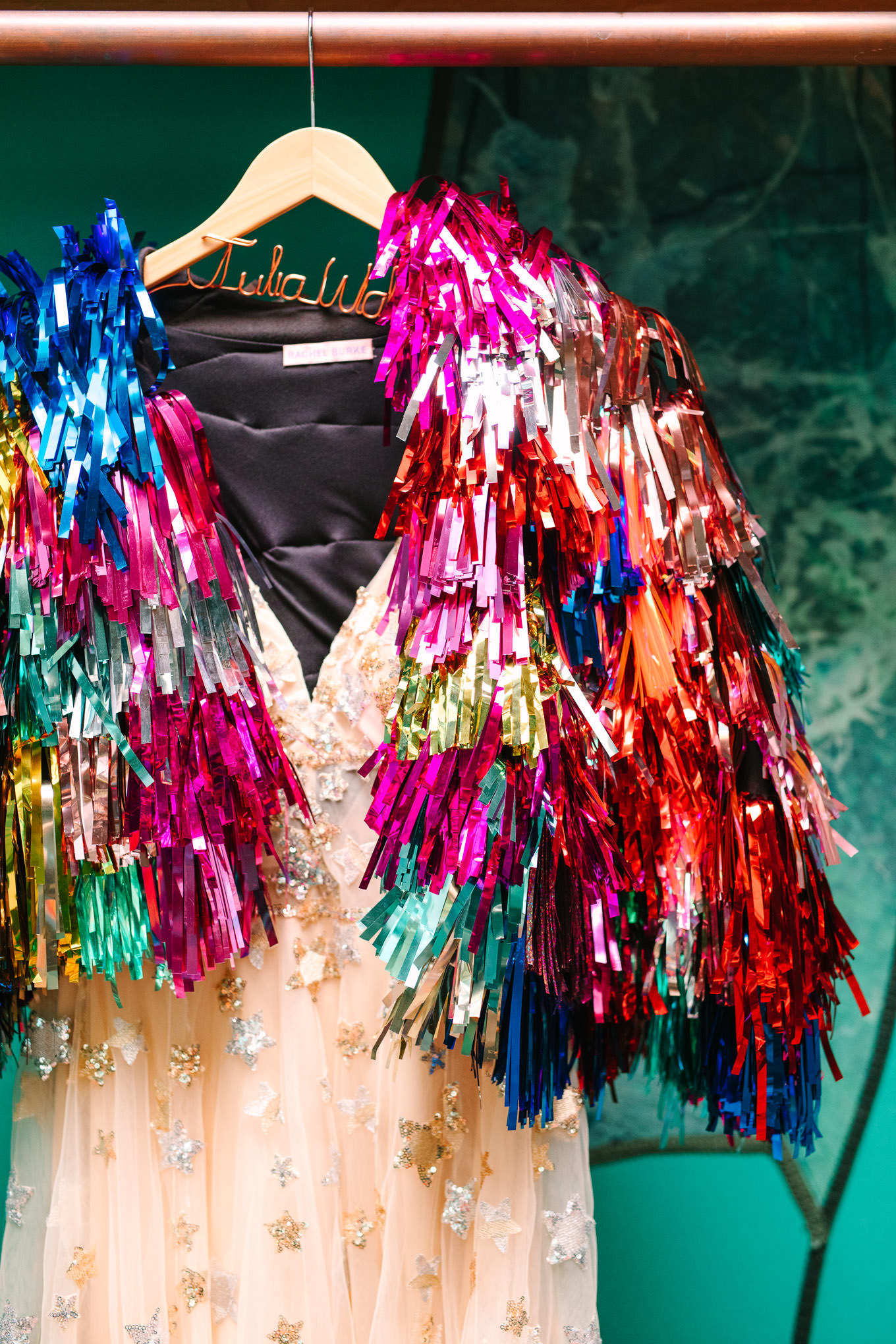 Rachel Burke tinsel jacket hanging on bridal gown | Colorful Downtown Los Angeles Valentine Wedding | Los Angeles wedding photographer | #losangeleswedding #colorfulwedding #DTLA #valentinedtla   Source: Mary Costa Photography | Los Angeles
