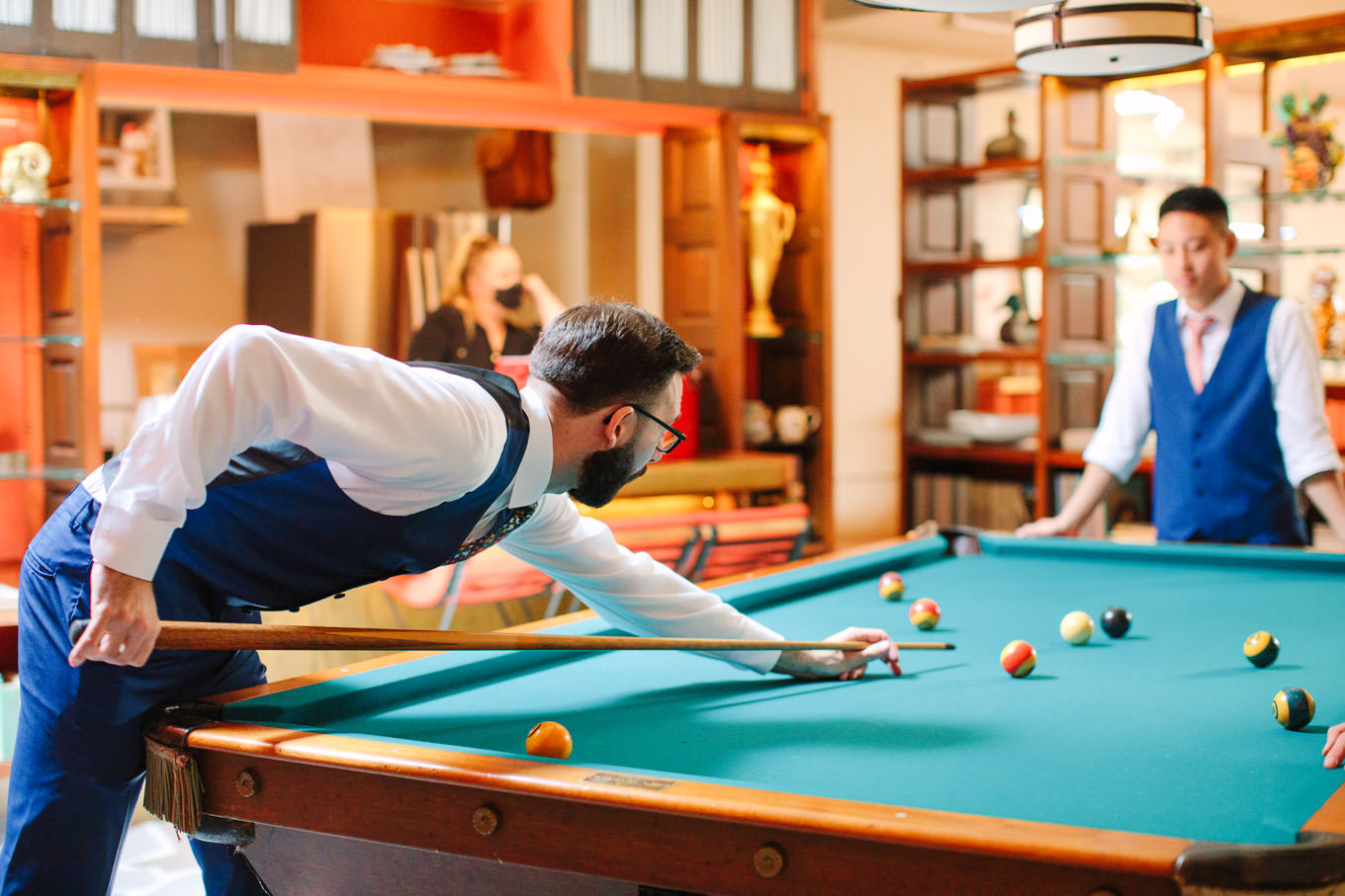 Groom and friends playing pool | Colorful Downtown Los Angeles Valentine Wedding | Los Angeles wedding photographer | #losangeleswedding #colorfulwedding #DTLA #valentinedtla   Source: Mary Costa Photography | Los Angeles