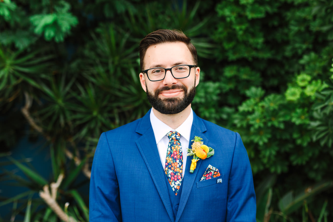 Groom in glasses, floral tie, and bright blue suit | Colorful Downtown Los Angeles Valentine Wedding | Los Angeles wedding photographer | #losangeleswedding #colorfulwedding #DTLA #valentinedtla   Source: Mary Costa Photography | Los Angeles