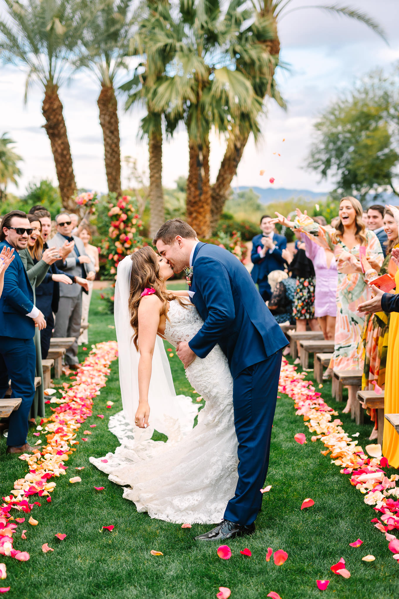 Bougainvillea Estate wedding ceremony couple kissing down the aisle | Wedding and elopement photography roundup | Los Angeles and Palm Springs photographer | #losangeleswedding #palmspringswedding #elopementphotographer Source: Mary Costa Photography | Los Angeles